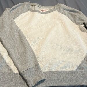 Gray and cream colored quilted sweatshirt